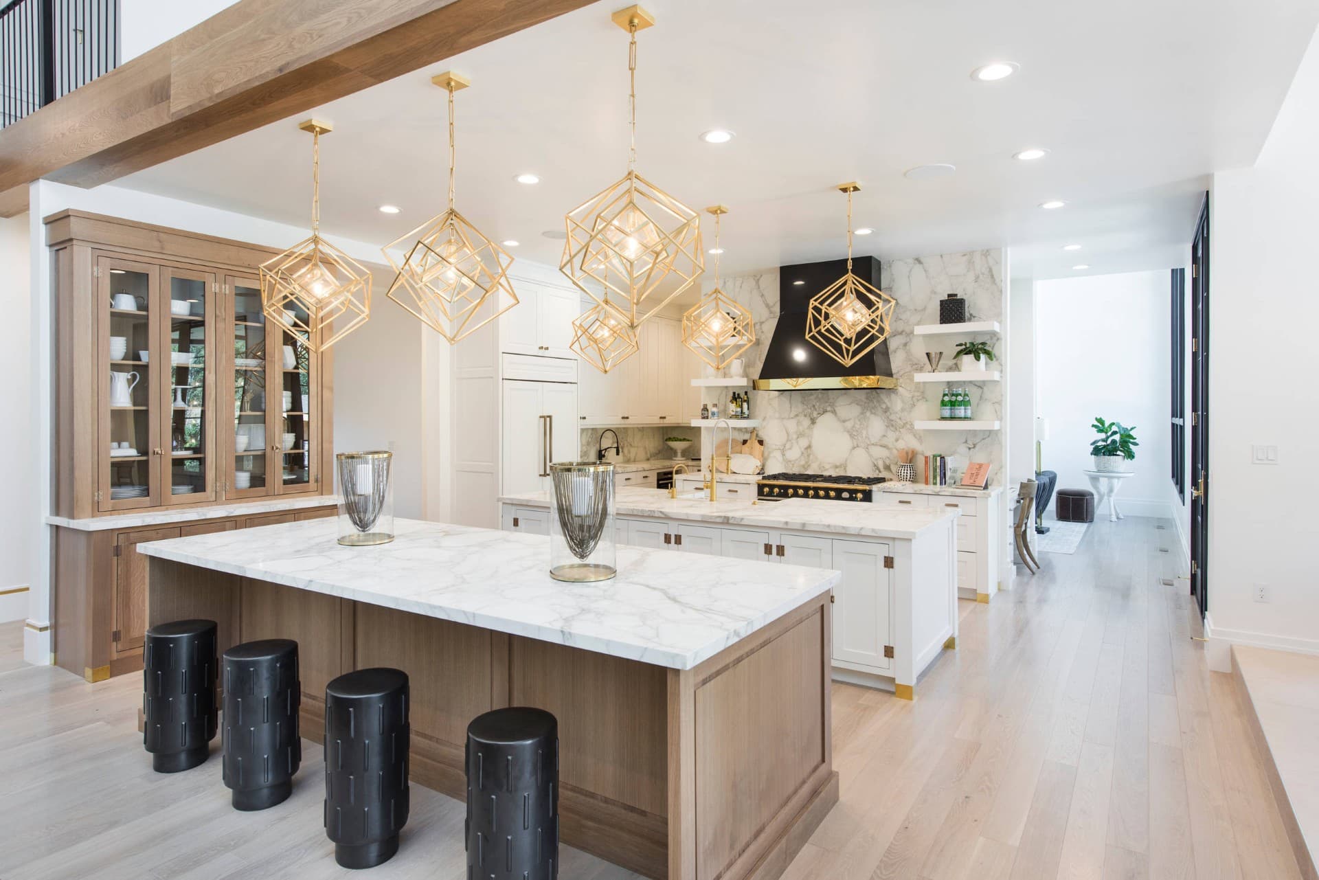 Interior inspiration showing a bright communal lounge with a large central counter and seating